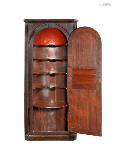Interior fitted with butler's 'table' A mid-18th century tall joined oak standing corner cupboard, English, circa 1730-50