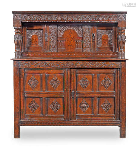 A James I joined oak and inlaid court cupboard, West Country, circa 1625