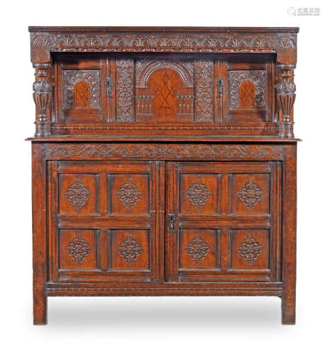A James I joined oak and inlaid court cupboard, West Country, circa 1625