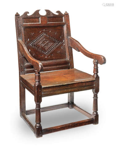 A Charles II joined oak panel-back open armchair, Lancashire circa 1670