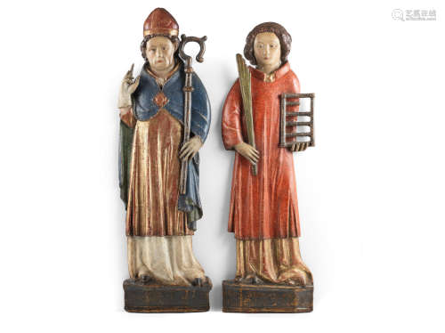 Probably 17th century A pair of carved oak and polychrome-decorated flat-backed figures, German