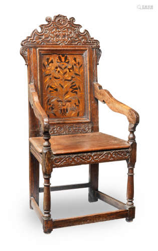 A mid-17th century joined oak and marquetry-inlaid panel-back open armchair, Yorkshire, circa 1640-60 and later