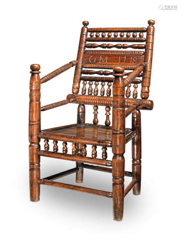 A rare and documented George I fruitwood turner's chair, probably Devon or Somerset, dated 1718