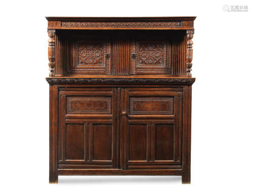 A James I joined oak court cupboard, West Country, dated 1620