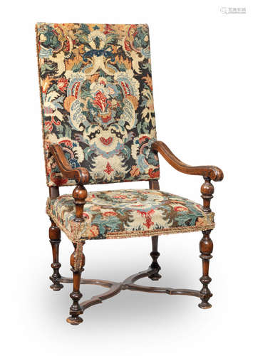 A 17th century walnut and needlework-upholstered open armchair, Franco-Flemish