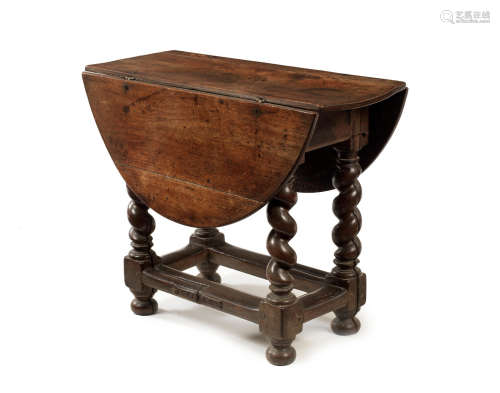 A late 17th century joined walnut and oak gateleg table, Dutch, circa 1680