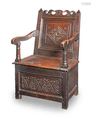 A Charles II joined oak box-seat panel-back open armchair, Lancashire, circa 1670