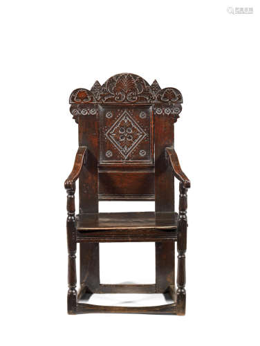 A Charles II joined oak 'Durham' panel-back open armchair, circa 1670