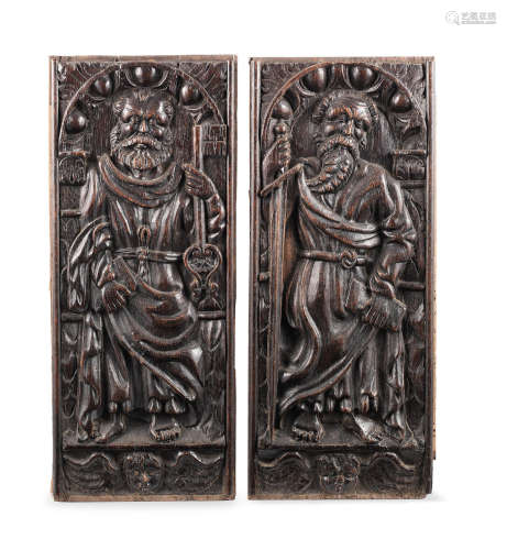 A pair of mid- to late 16th century carved oak panels, French, carved with the figures of saints