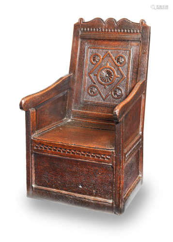 A Charles I joined oak enclosed armchair, circa 1640