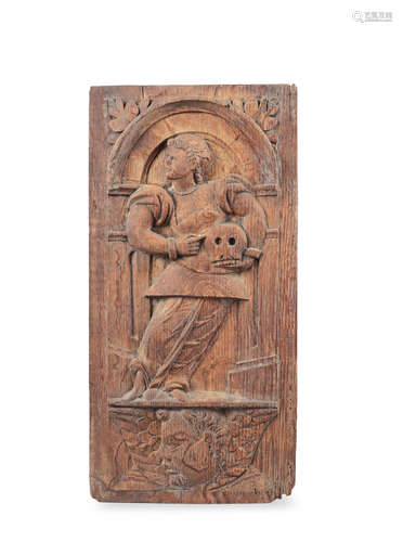 A mid-16th century carved oak panel, Northern French, St Francis