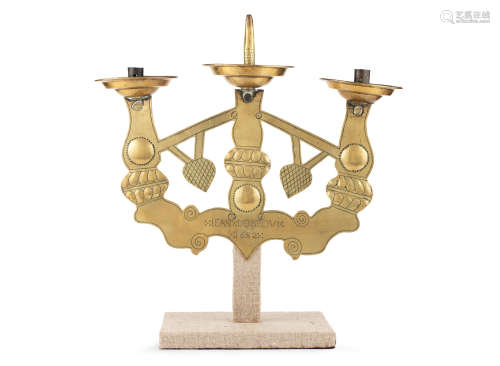 A late 17th century sheet brass candelabrum, probably a tenebrae hearse, French, dated 1682