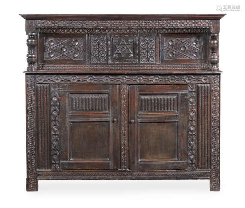 A Charles I joined and boarded oak court cupboard, Derbyshire, circa 1630