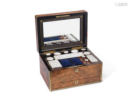 unmarked  A late 19th century silver-plated dressing set in a walnut case