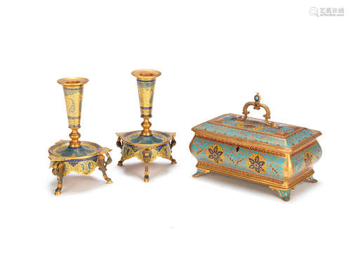 both in the Moorish style A late 19th / early 20th century French gilt bronze and champleve enamelled box together with a pair of similar candlesticks