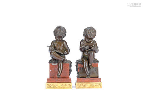 A pair of patinated bronze putto figures of seated putti