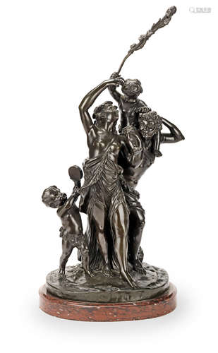 After Claude Michel Called Clodion (French, 1738-1814): A patinated bronze figural group of a male and female baccante and two putti