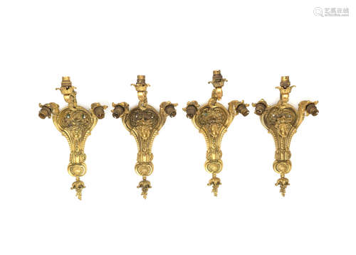 in the Louis XV style A set of four early 20th century French gilt bronze three light wall appliques