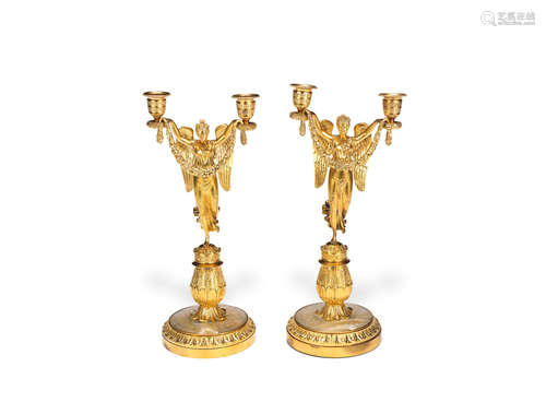 in the Palais Royal style  A pair of Charles X gilt bronze figural candlesticks