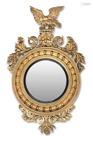 A large Regency carved giltwood convex mirror