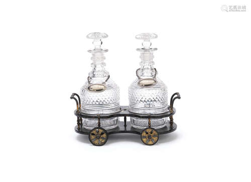 A mid Victorian japanned papier mache decanter wagon together with a pair cut glass decanters and stoppers