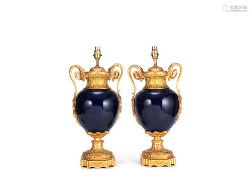 in the Louis XVI style A pair decorative gilt bronze and 'bleu de roi' porcelain lampbases