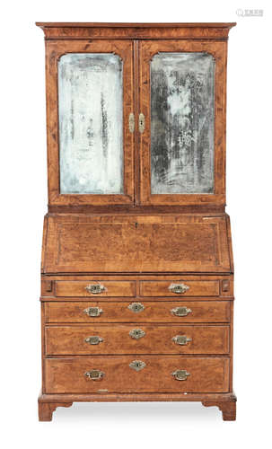 A George II walnut and featherbanded bureau cabinet