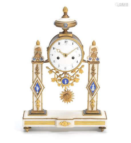 A late 18th / early 19th century French gilt bronze, white marble and pale blue jasper biscuit porcelain inset mantel clock