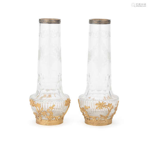 possibly by Baccarat, early 20th century A pair of French gilt bronze mounted cut and engraved glass garniture vases