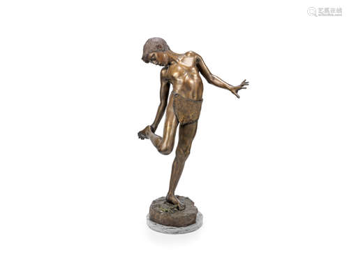 Annibale DeLotto (Italian 1877-1932): A patinated bronze figure of a boy with a crab