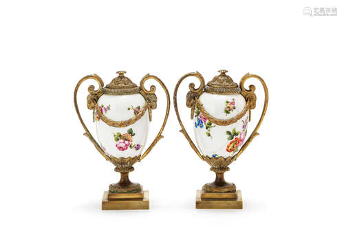 the mounts by Matthew Boulton and John Fothergill, circa 1775, the associated Sèvres porcelain bodies probably late 18th or early 19th century A pair of late 18th century and later adapted gilt bronze mounted porcelain casselottes or candle vases