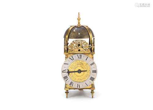 A reproduction brass lantern clock