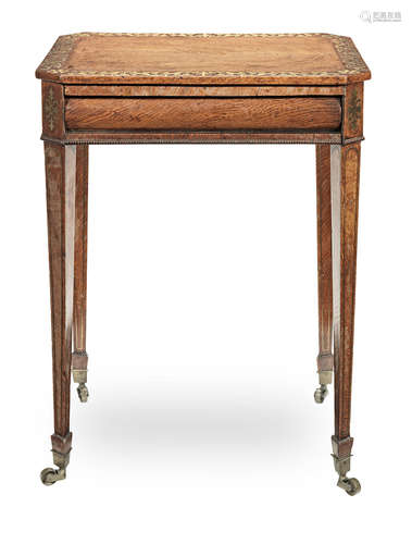 in the manner of George Oakley A Regency figured oak, rosewood banded and brass inlaid reading/work table