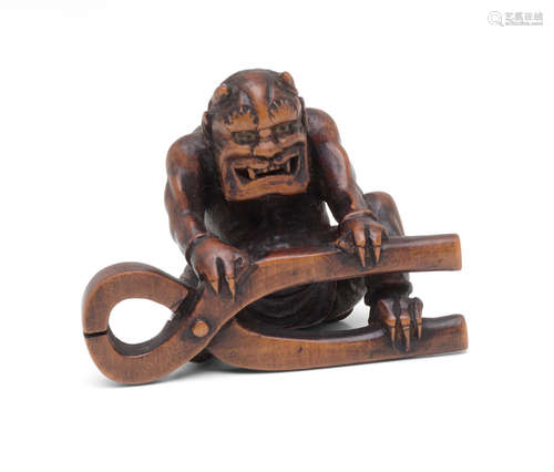 Edo period (1615-1868), 19th century A wood netsuke of an oni