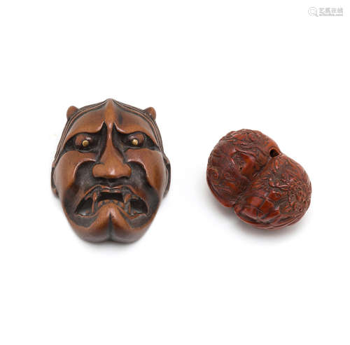 The first by Hidari Issan, Edo period (1615-1868) or Meiji era (1868-1912), 19th/20th century A fruit nut netsuke and a wood mask netsuke