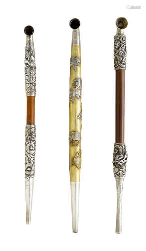 Edo period (1615-1868) or Meiji era (1868-1912), 19th/20th century A shinchu kiseru (pipe) and two silver and bamboo kiseru (pipes)