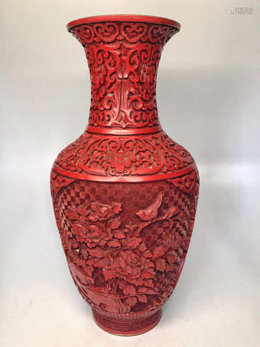 A FLORAL DESIGN RED LACQUERWARE GUANYIN VASE