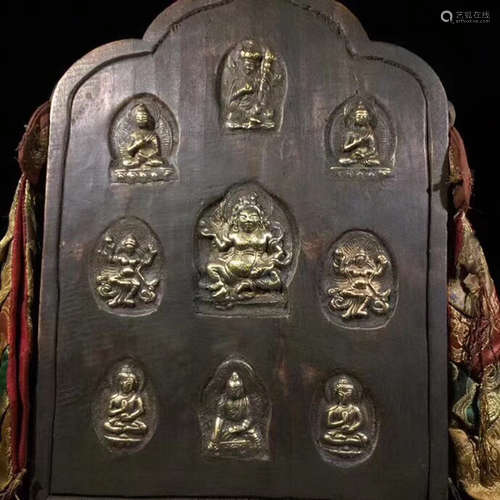 A TIBETAN HUNDRED-YEAR WOOD BUDDHA DESIGN PENDANT WITH COPPER