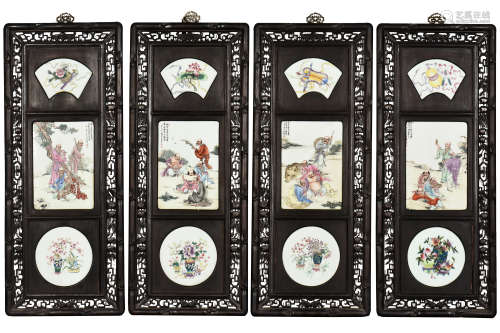 WANG DAFAN: SET OF FOUR WOOD PLAQUES INSET WITH FAMILLE ROSE PORCELAIN 'EIGHTEEN ARHAT'