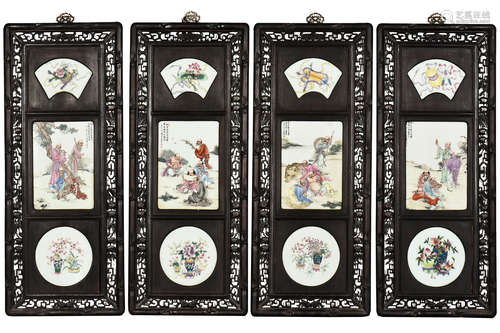 WANG DAFAN: SET OF FOUR WOOD PLAQUES INSET WITH FAMILLE ROSE PORCELAIN 'EIGHTEEN ARHAT'