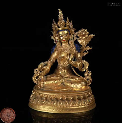 A GILT BRONZE MOLDED TARA BUDDHA STATUE