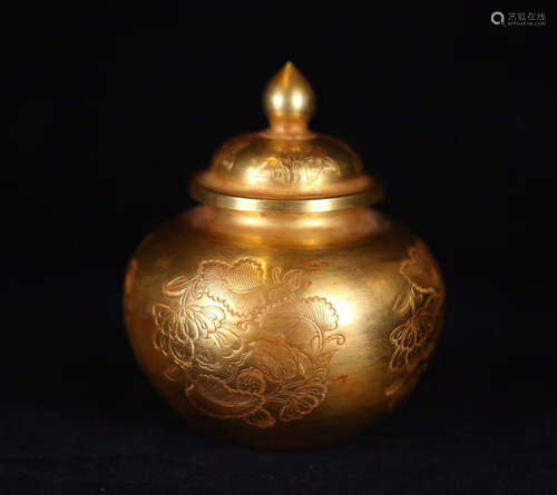 A GOLDEN FLORAL CARVED JAR