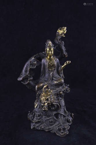 A GILT BRONZE MOLDED DRAGON GUANYIN STATUE