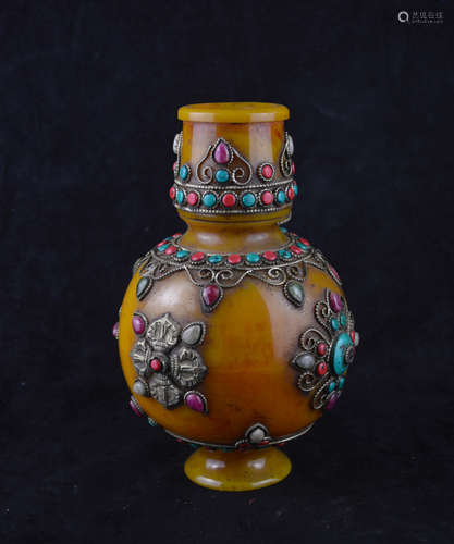 A GEM STONES DECORATED GLASS VASE