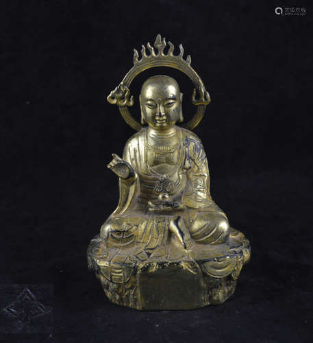 A GILT BRONZE MOLDED BUDDHA STATUE