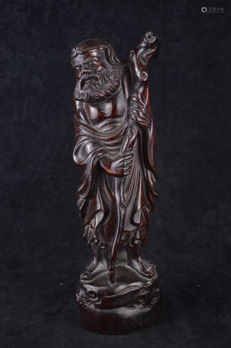 A TAOIST LI HE IMMORTAL SHAPED WOOD CARVING