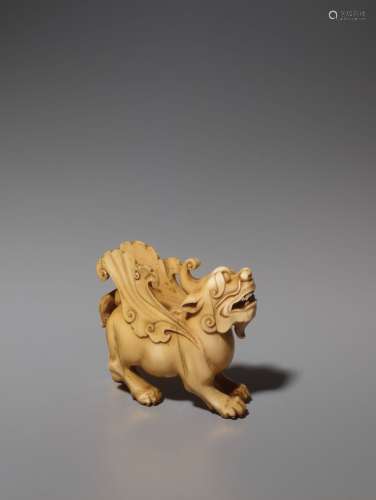 Chinese Works of ArtAN IVORY CARVING OF A MYTHI...