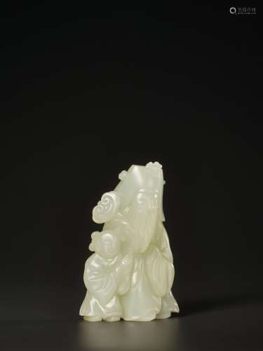 Chinese Works of ArtA WHITE JADE FIGURE OF AN I...