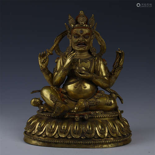 TIBETAN GILT BRONZE SEATED FOUR ARM MAHAKALA BUDDHA