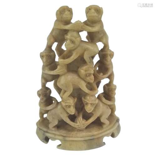 A Stone Carving of 10 Monkeys